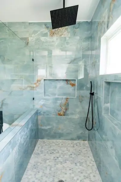 Modern master bathroom with stunning aqua blue 24x48 large format tile